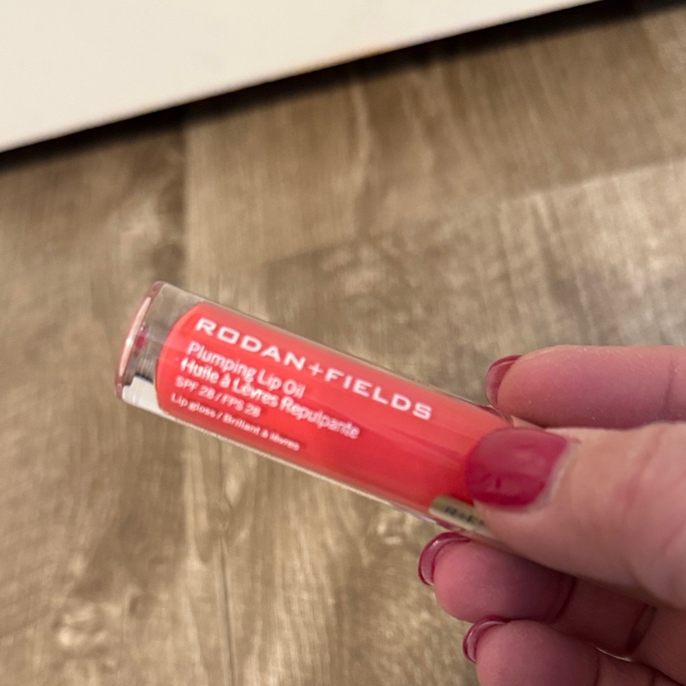 Rodan + Fields Lip Oil in coral